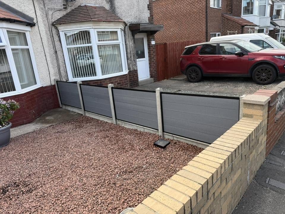 Completed composite fencing across the front garden boundary