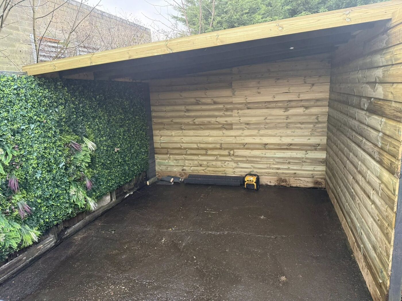Covered timber pergola with shiplap walls